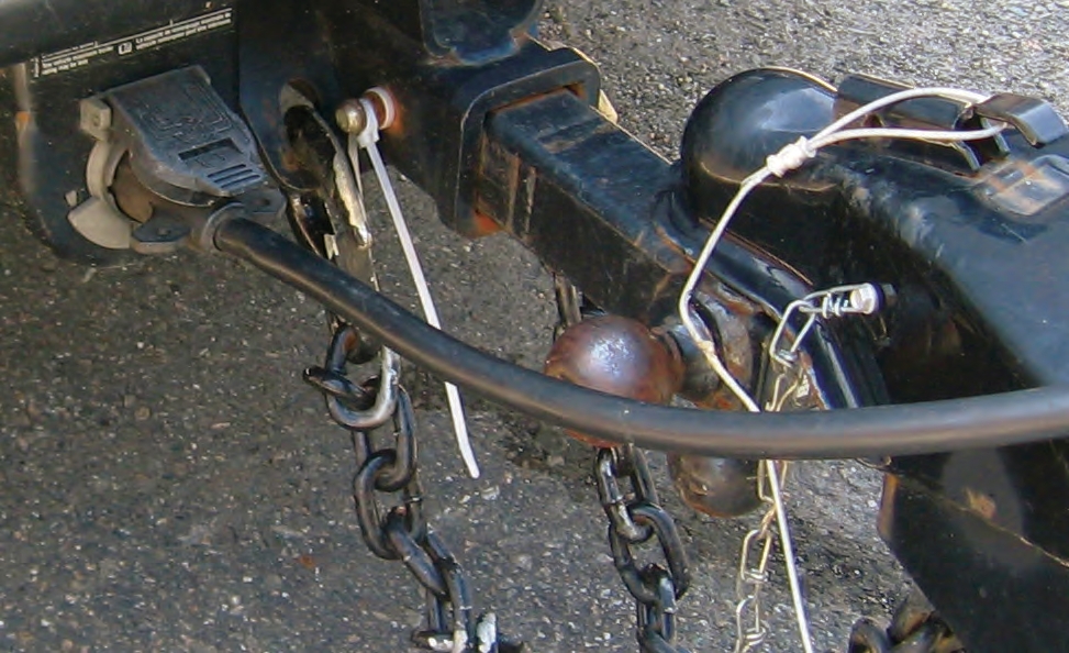 Never invent your own solutions, as this driver who used a tie-strap around the pin to secure it in place.