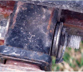 Drilling through a bolt to create a hole for a locking pin is a bad idea. It weakens the bolt and makes the assembly less safe.