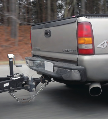 This truck has safety chains that have been properly criss-crossed.