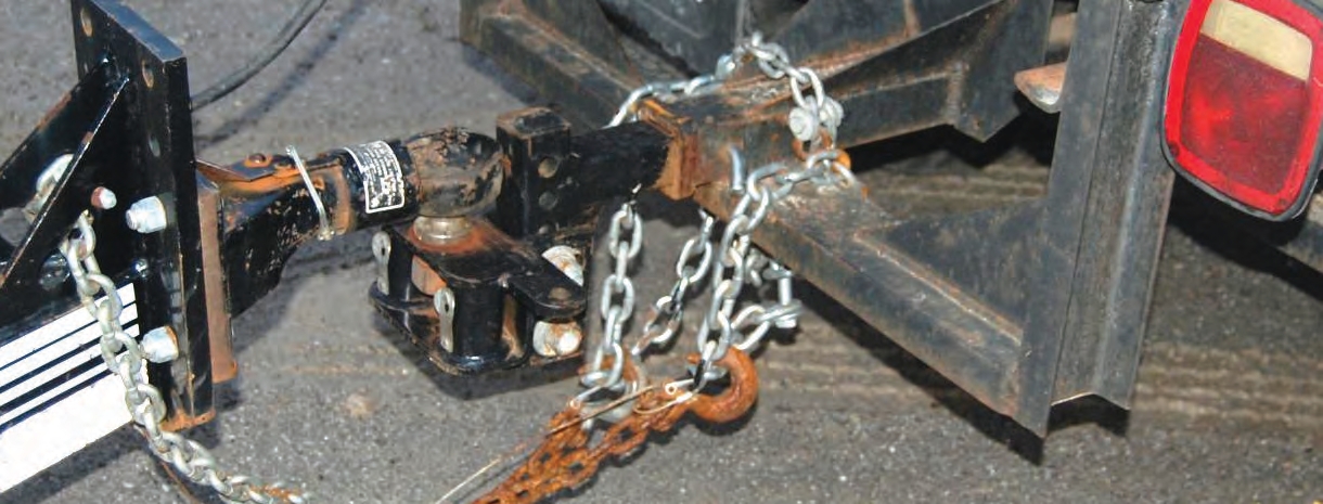 When a truck has no dedicated points to attach safety chains, be safe. Do not attach chains with bolts. Instead, attach a certified D-ring to the frame on the back of the truck.