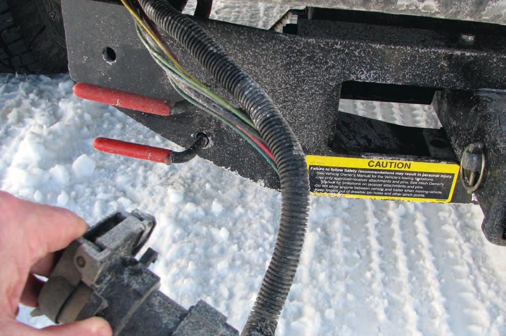 Broken covers or split wire housings can lead to brake and light failures.