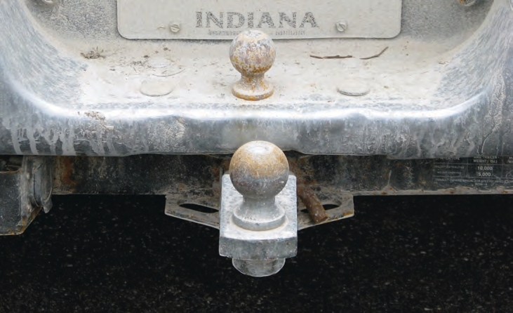 Never modify a bumper by cutting a larger opening. It weakens the bumper and reduces the weight it can tow.