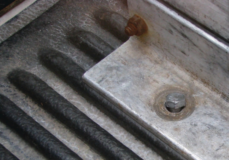 Bolts that hold the frame to the truck are critical stress points. Replace bent bolts with bolts that are graded for such stress.