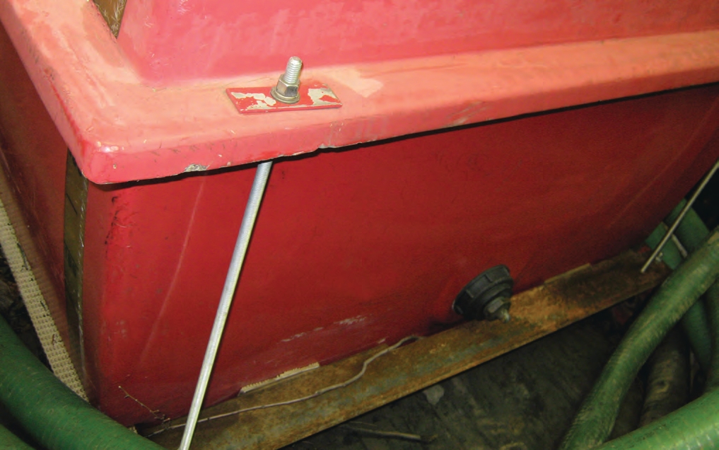 These metal rods link the fiberglass tank to the metal frame.