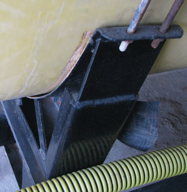The soft insert for this tank fell out and the tank was damaged when it rubbed against the metal frame.