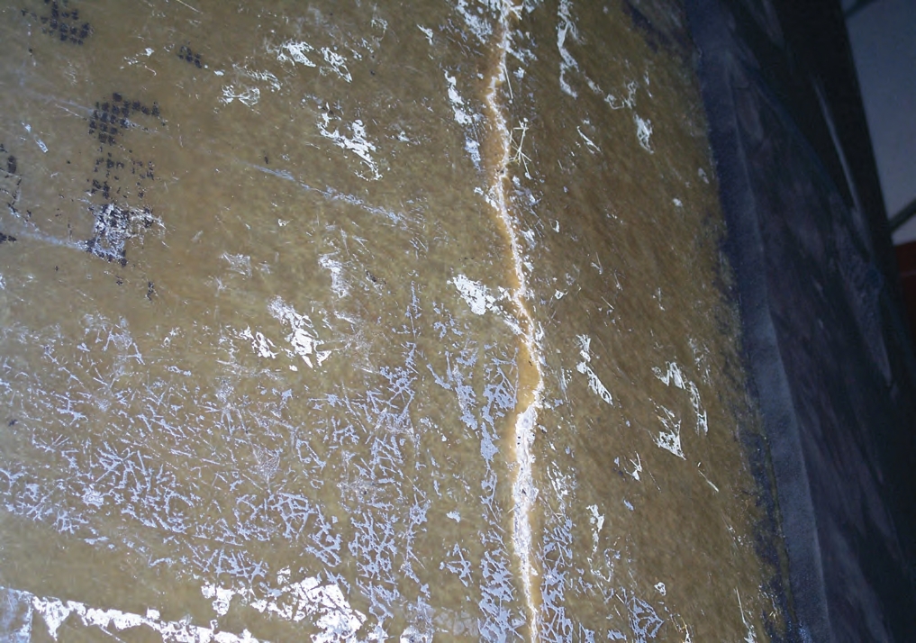 This unvented tank cracked when the operator was pulling liquid out of the tank. The sidewall cracked on the outside 