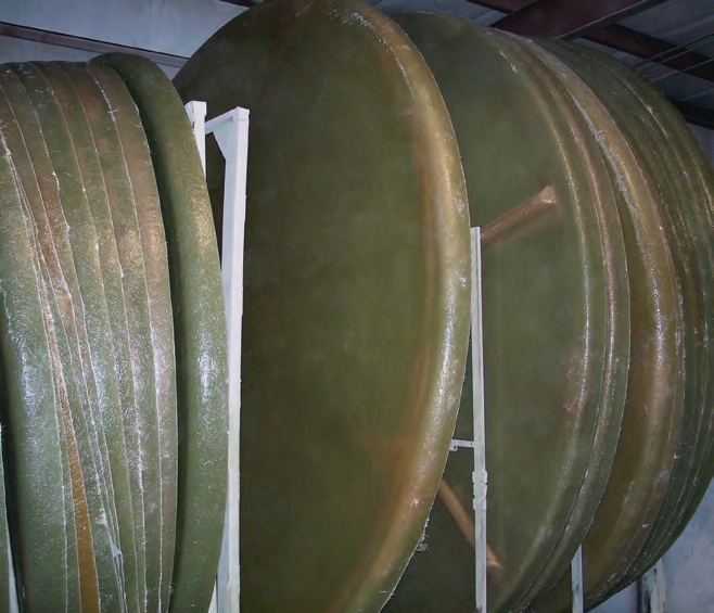 Individual rivets in a fiberglass tank. These tanks (12 feet diameter x 10 feet tall) are ready for the final fiberglass layers to be added 