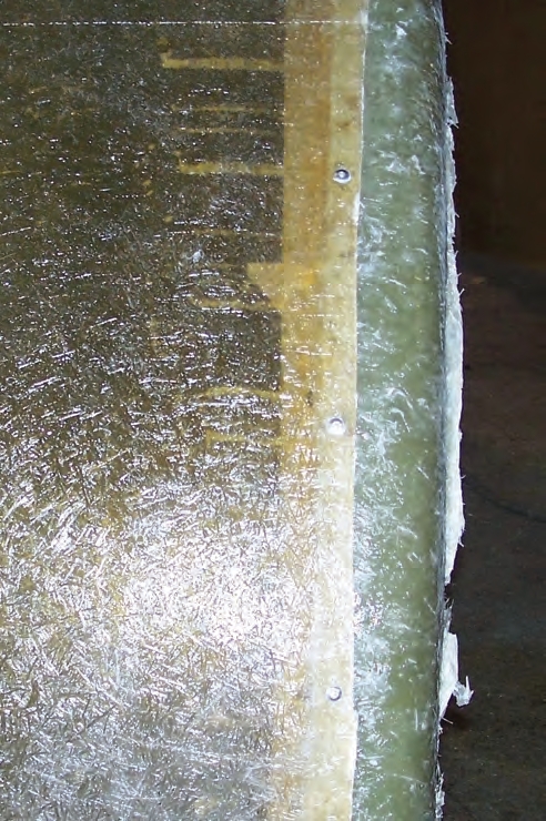 Individual rivets in a fiberglass tank. These tanks (12 feet diameter x 10 feet tall) are ready for the final fiberglass layers to be added 