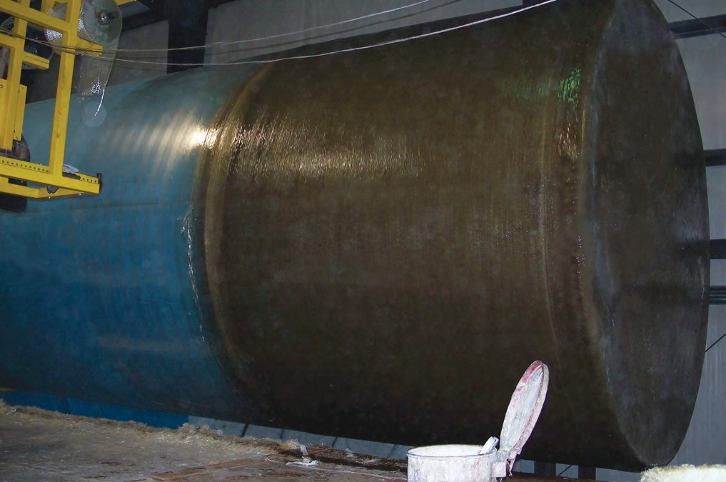 This tank has been wrapped with a woven mat and has had a hoop line added. It is now ready to be removed from the blue mold.