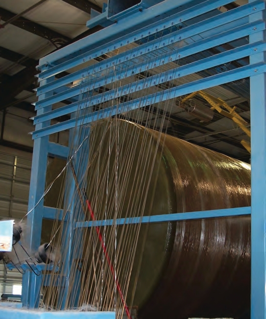 When the tank is built, glass strands are wrapped around the spinning mandrel