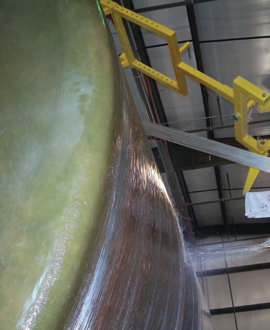 After that, the manufacturer applies the chop hoop layer, laying down “ropes” of glass that are made of about 60 strands each.