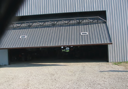 Don’t forget to leave enough room for the overhead doors to slide into the building and have enough clearance for the tanks.