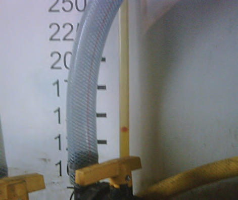 The red ball floating in the liquid helps you gauge how much is left in the tank.