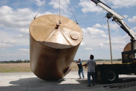 forklift or front-end loader to position the tank and place it upright once it is unloaded.