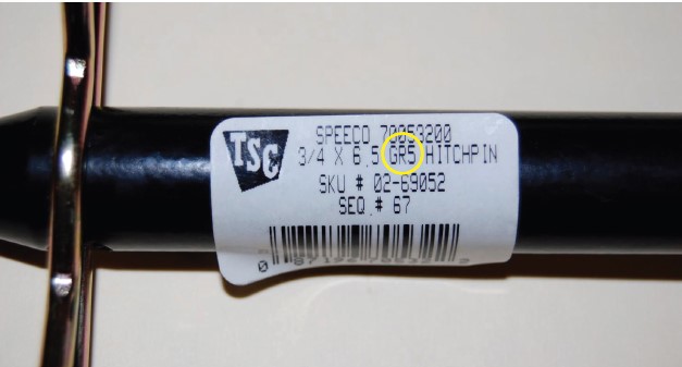 The labels on new hitch pins may include important information, including its grade (circled).