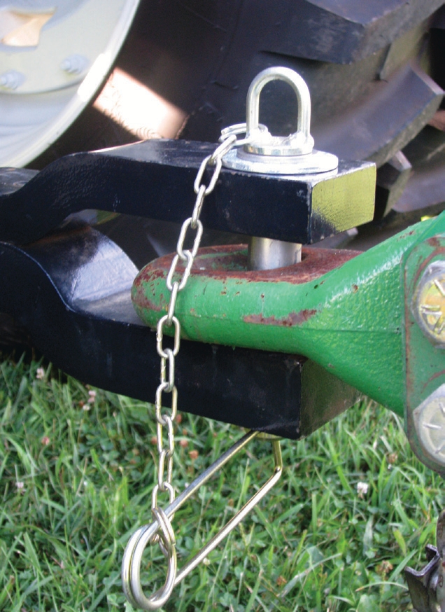 The clip is attached to the hitch pin, which allows the pin to be reinserted if it is pulled out.