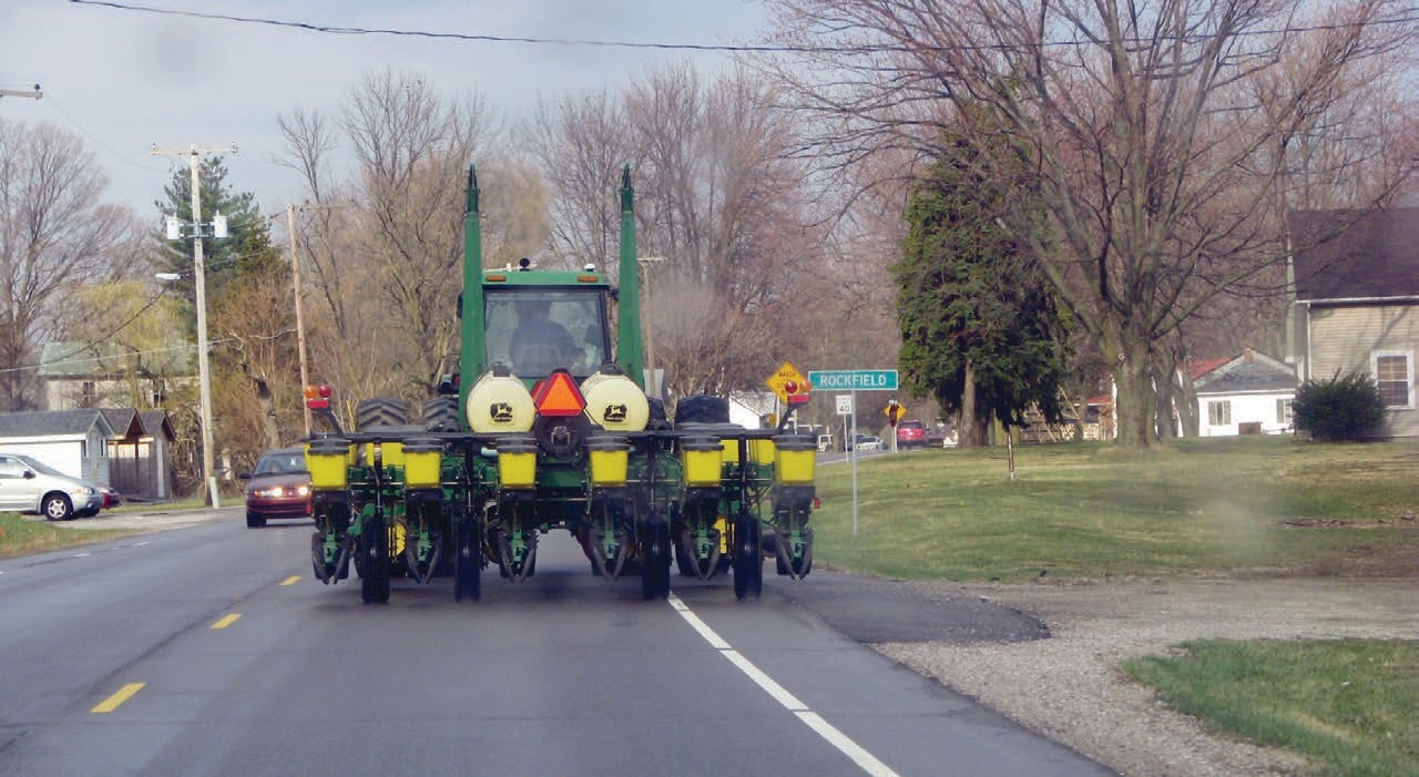 tractor drving on road