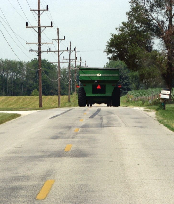 tractor drving on road