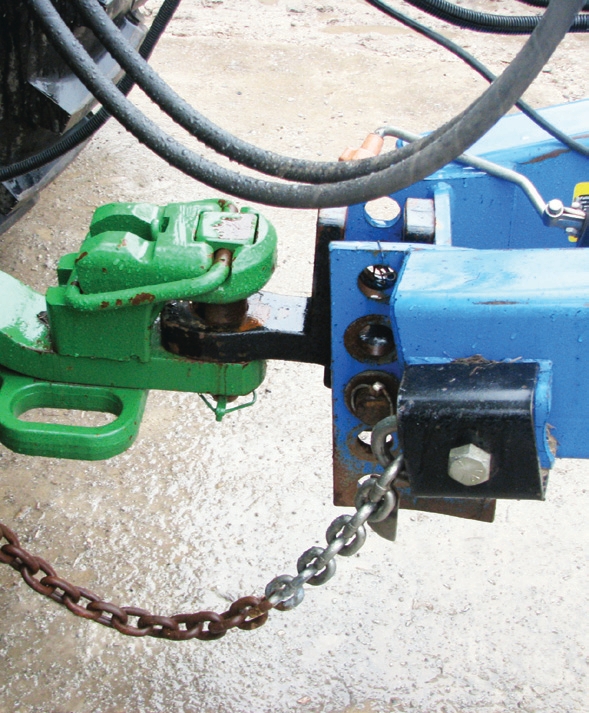 These photos show a pintle hook with a properly sized hitch pin and that is well secured with safety chains. A drawbar and hammer strap hitch pin system will drop the pin automatically when backing up to an implement.