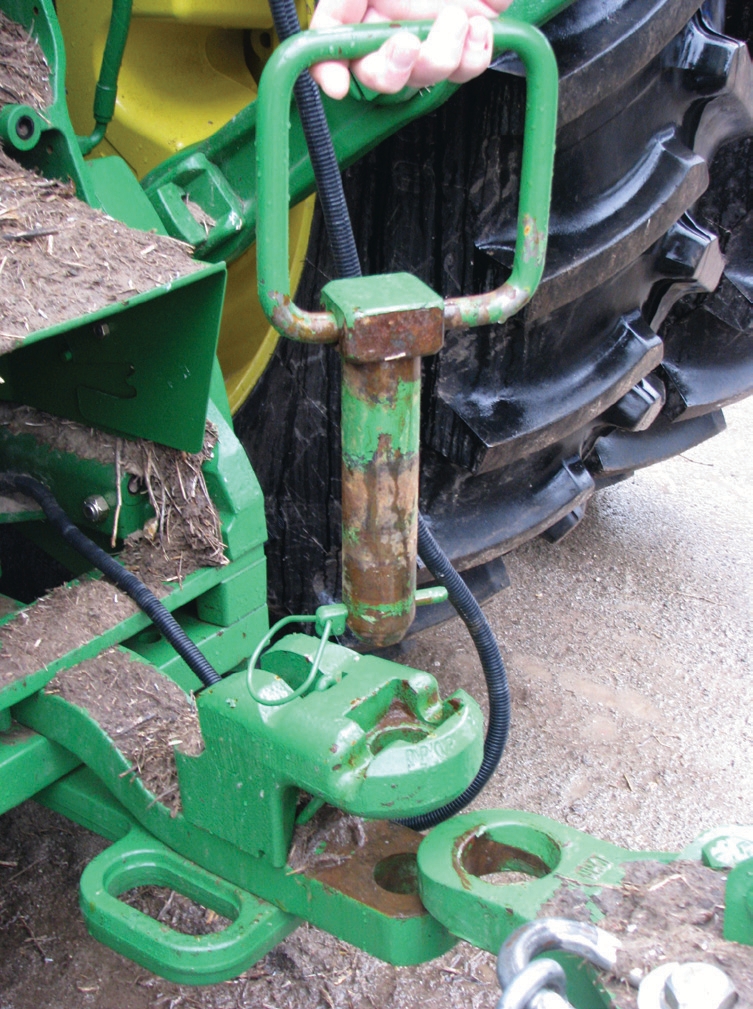 The pins fit very snugly in the drawbar hammer strap and operators often overlook this pin. In most cases, it is not even with the tractor.