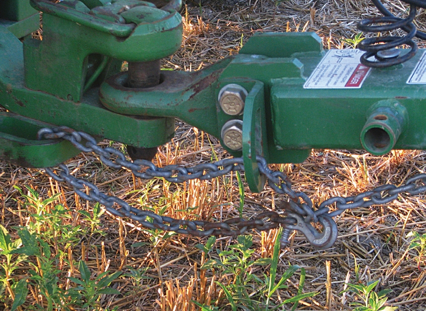 An improperly attached hook cancels out everything else that was done to keep the equipment attached to the tractor. Also notice that the intermediate support is being used improperly as part of the attachment point. Most tractor manuals give clear instructions about the use of intermediate support brackets.