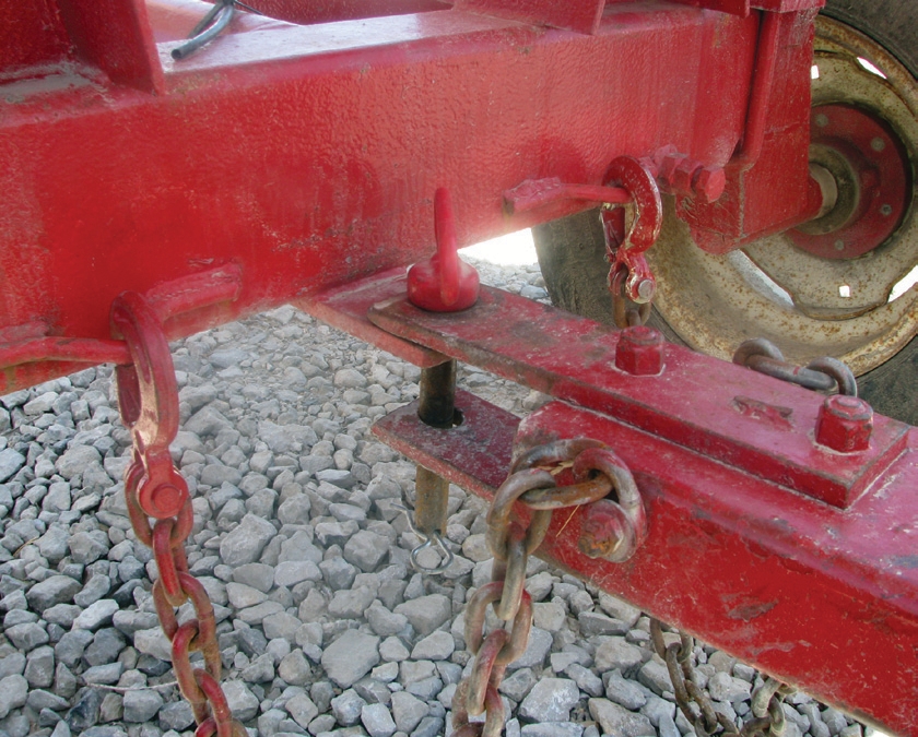 The welded frames on the front trailer allow a place to attach the safety chains from the trailing unit.