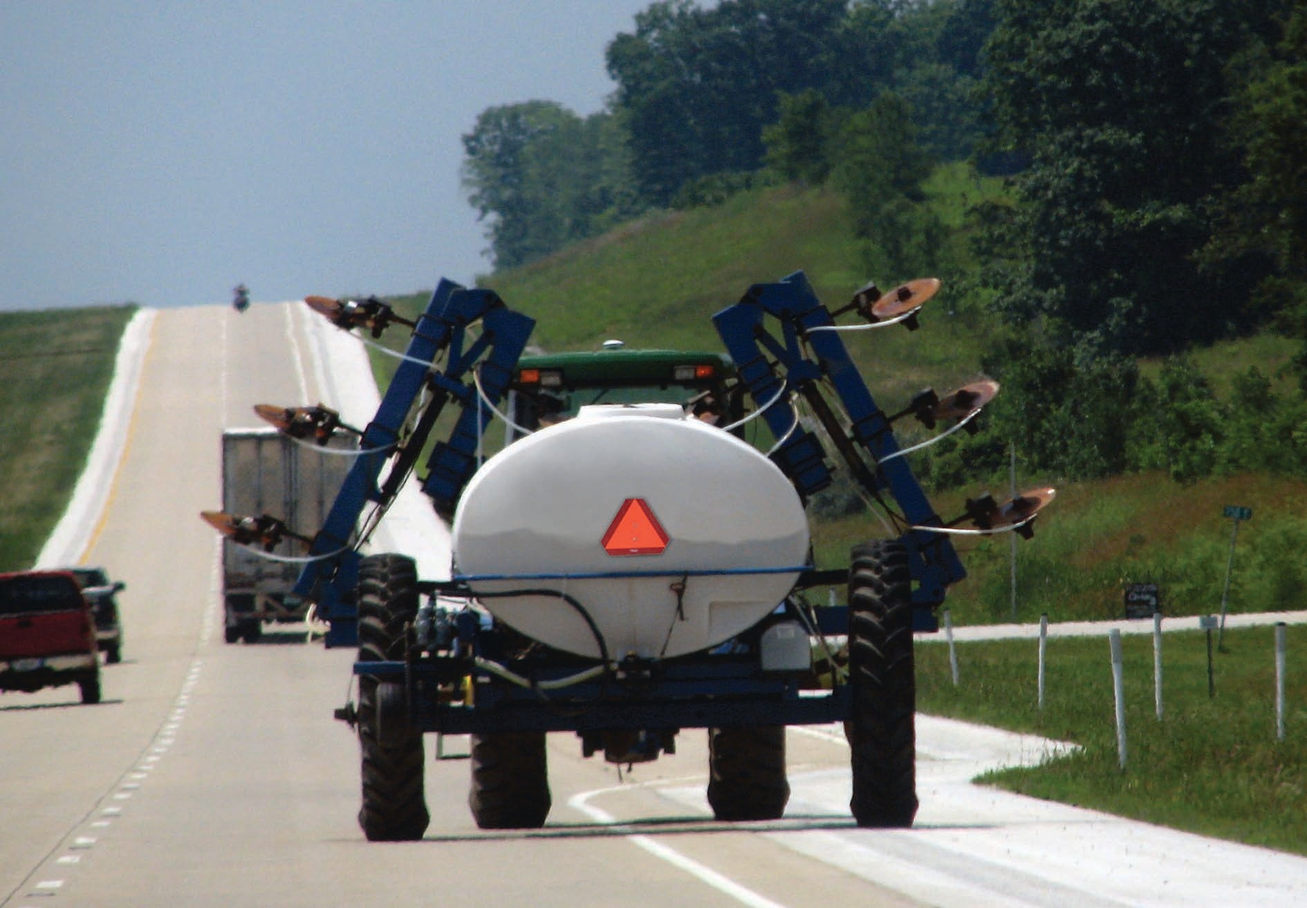 Tractor riding on a road