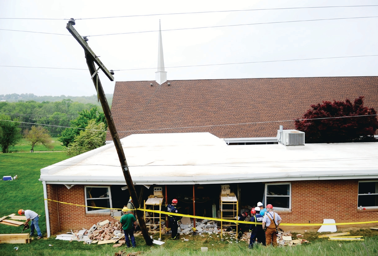 grain drill rolled downhill and crashed into a church