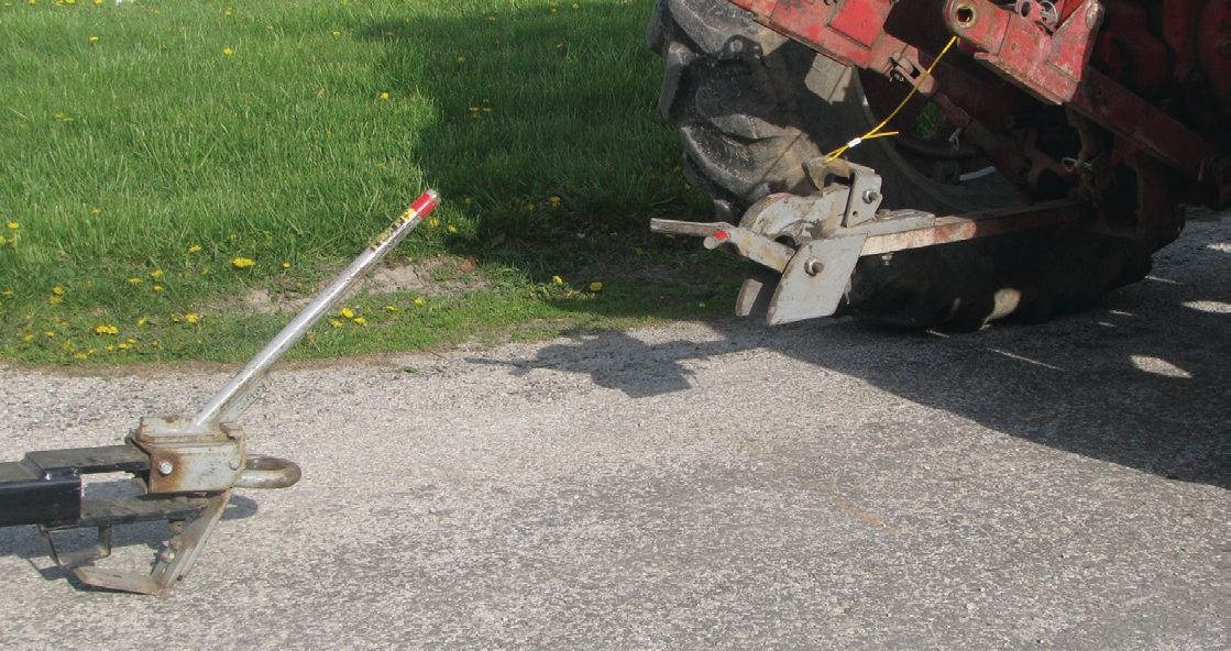 novel devices that allow the tractor and wagon to be connected and disconnected without the driver having to leave the cab.