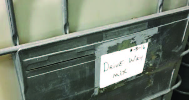 hand-written labels taped to minibulks that read “Drive Way (sic) Mix.”