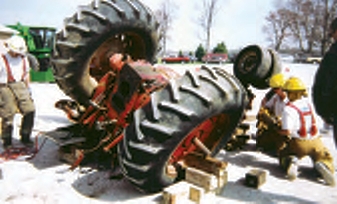 Toppled Tractor being repaired by emergency responders