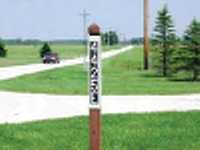 911 road or highway address in 3-inch reflective letters and numbers on a sign by your driveway