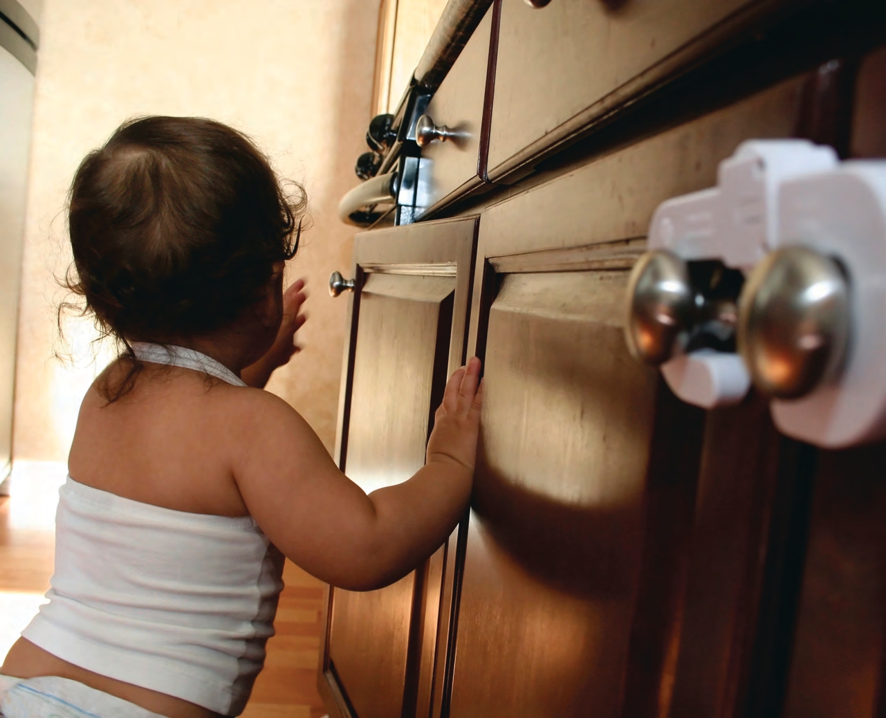 child standing near a dor