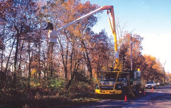 Truck parked on the side of the road with emergency cones