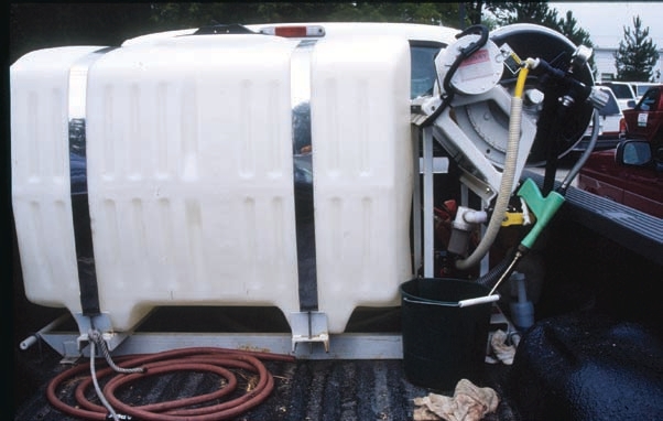 permanent tanks securely attached  to the vehicle.