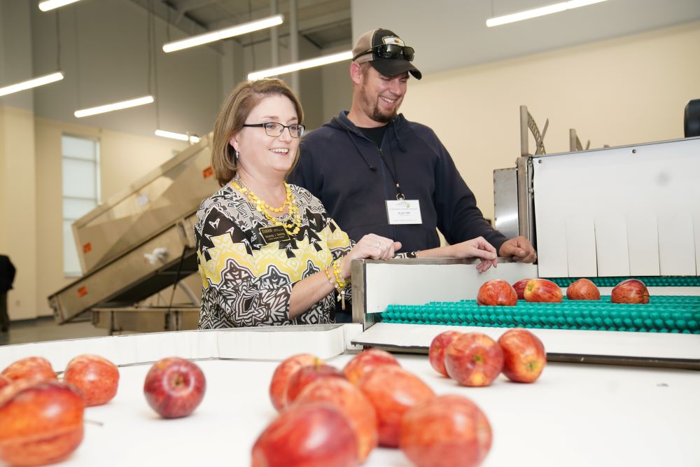 Amanda Deering training a produce grower