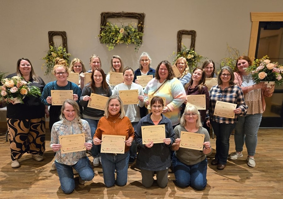 Image of participants in a past Annie's Project course celebrating.
