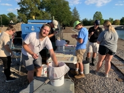 American Fisheries Society students volunteer to stock pond at Columbian Park Zoo, Lafayette.