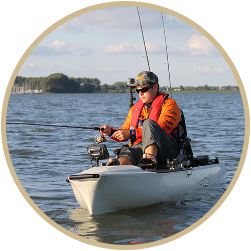 Outdoor Recreation Manager on water in kayak conducting checks on fish.