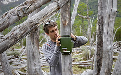 Dante Francomano attaches an acoustic sensor to a pole