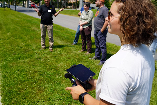 Fellowship student operating drone.