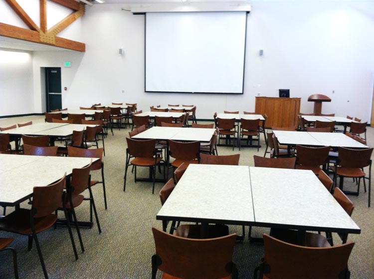 John S. Wright Center large conference room with double tables set up.