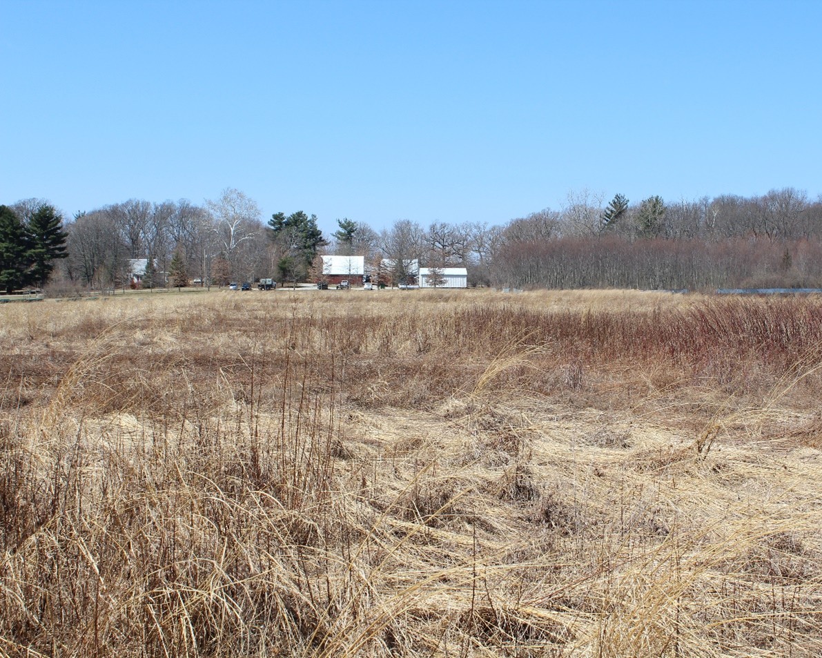 Purdue Wildlife Area grassy field with building