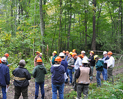 Group gathered in the forest of Southern Indiana Purdue Ag Center.