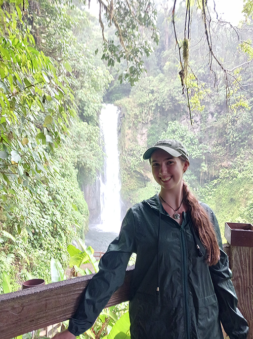 Brianne Brummett in front of a waterfall.