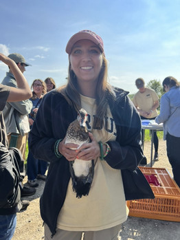 Marina Dhillon holds a bird resembling a duck.