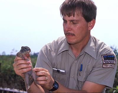 Scott Johnson holding a Franklin's ground squirrel