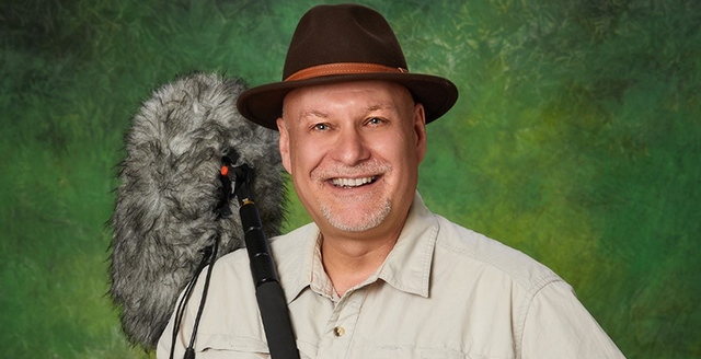 Dr. Bryan Pijanowski holds a field microphone