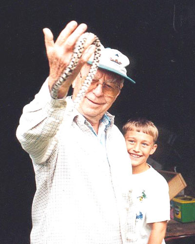 Patrick Ruhl pictured with his grandfather and a snake.jpg