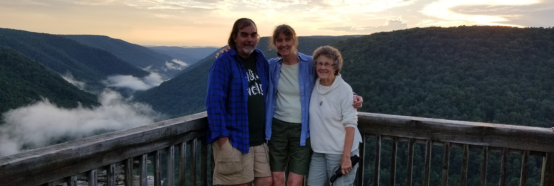 Petra Bohall Wood pictured with her family in front of a mountain rangeily 